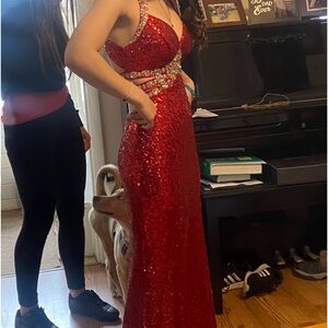 Long red dress with rhinestones.